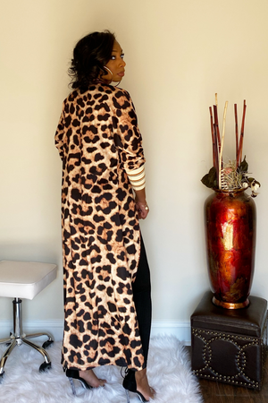 The back view of cardigan with leopard print patter from top to bottom. The cardigan is full length and goes down to ankles.